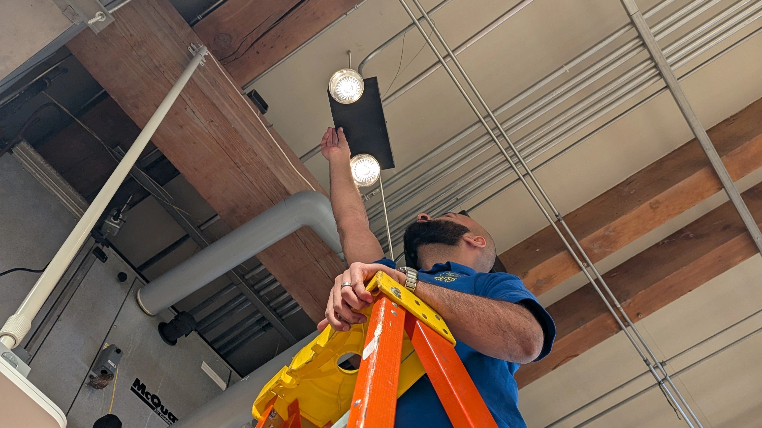 Emergency lighting unit and exit sign certified by Boss Fire technicians