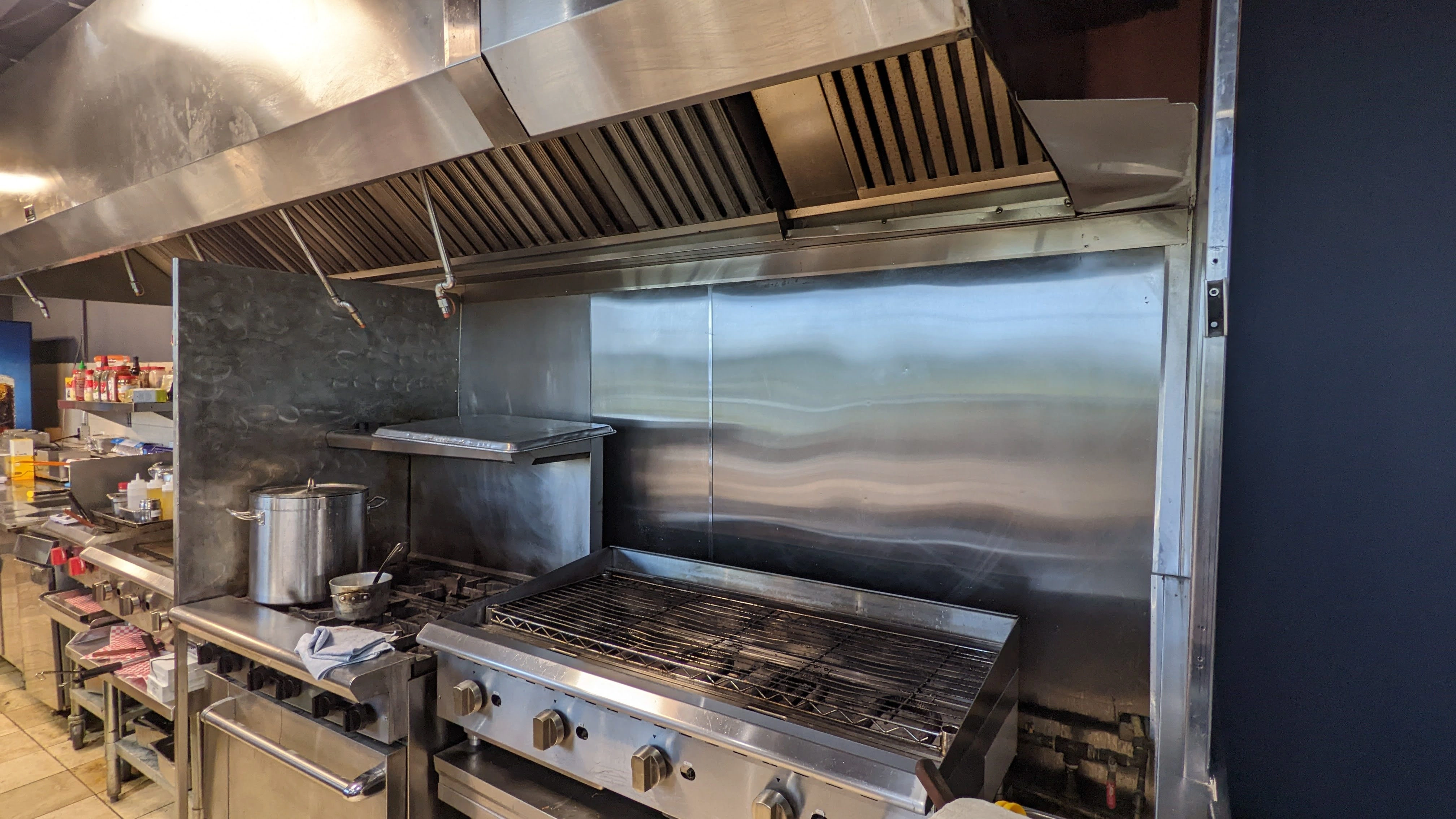 Commercial kitchen hood suppression nozzles inspected by Boss Fire Inc.